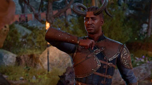 Wyll from Baldur’s Gate 3, wearing leather armor and curved horns, gestures while speaking in camp.